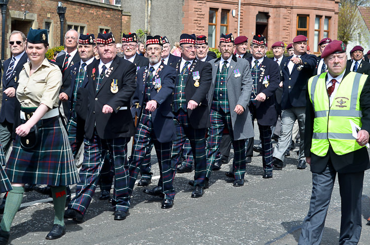 Veterans march past Veterans Monument in Glasgow 2015